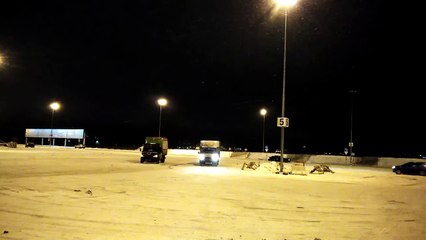 Trucks Drift For Fun in Snowy Lot