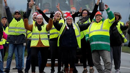 Die Bilder der Woche: Gelbe Westen, Bush, schlechte Luft in Sarajewo