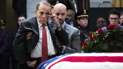 Bob Dole Stands To Salute Late President George HW Bush