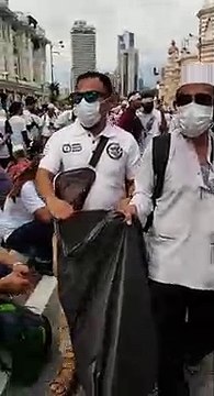 Volunteers collect trash at anti-ICERD rally