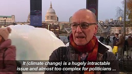 Ice block art glimmers in London to warn against climate change