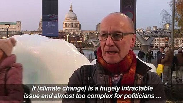 Ice block art glimmers in London to warn against climate change