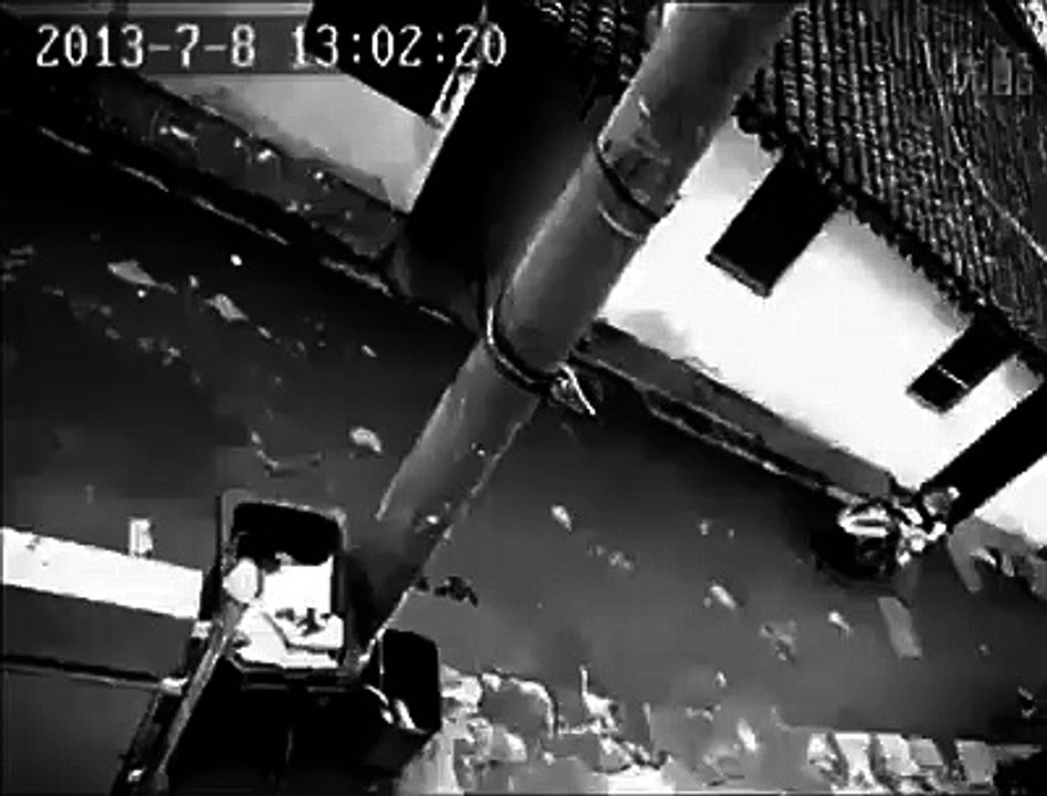 UFO and Mysteries - Strange creature on the roofs captured by a security camera