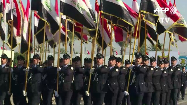 Iraqi forces hold military parade one year after IS defeat