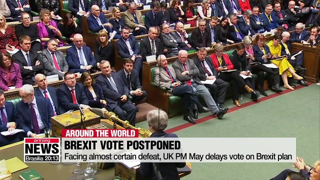 Facing almost certain defeat, UK PM May delays vote on Brexit plan