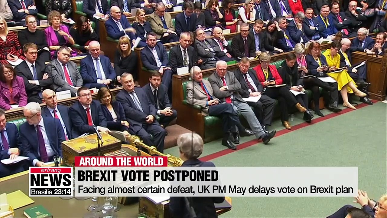 Facing almost certain defeat, UK PM May delays vote on Brexit plan