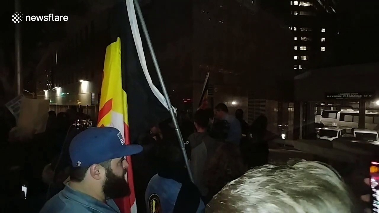 Activists stage rally in downtown LA to support asylum seekers on International Human Rights Day