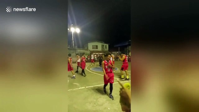 Basketball referee does cartwheels and splits when a player scores