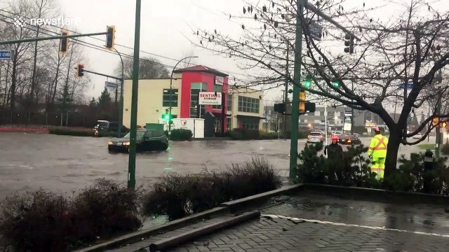 Cars stranded on flooded streets after heavy downpour inundates Metro Vancouver