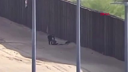 ABD'ye Kaçak Geçişte Bir Çocuğun 5 Metrelik Duvardan Düşüşü Güvenlik Kamerasında