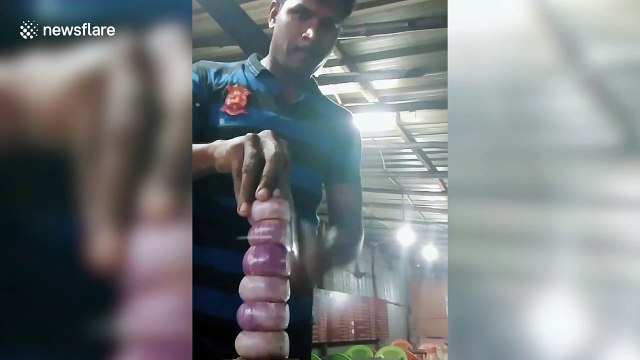 Clever chef slices 'tower of onions' using deft knifework