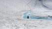 Skier Backflips Over Frozen Pond