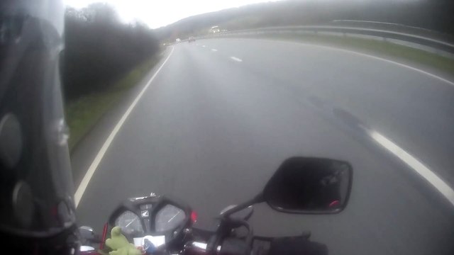 Car Overtaking Motorbike in Same Lane