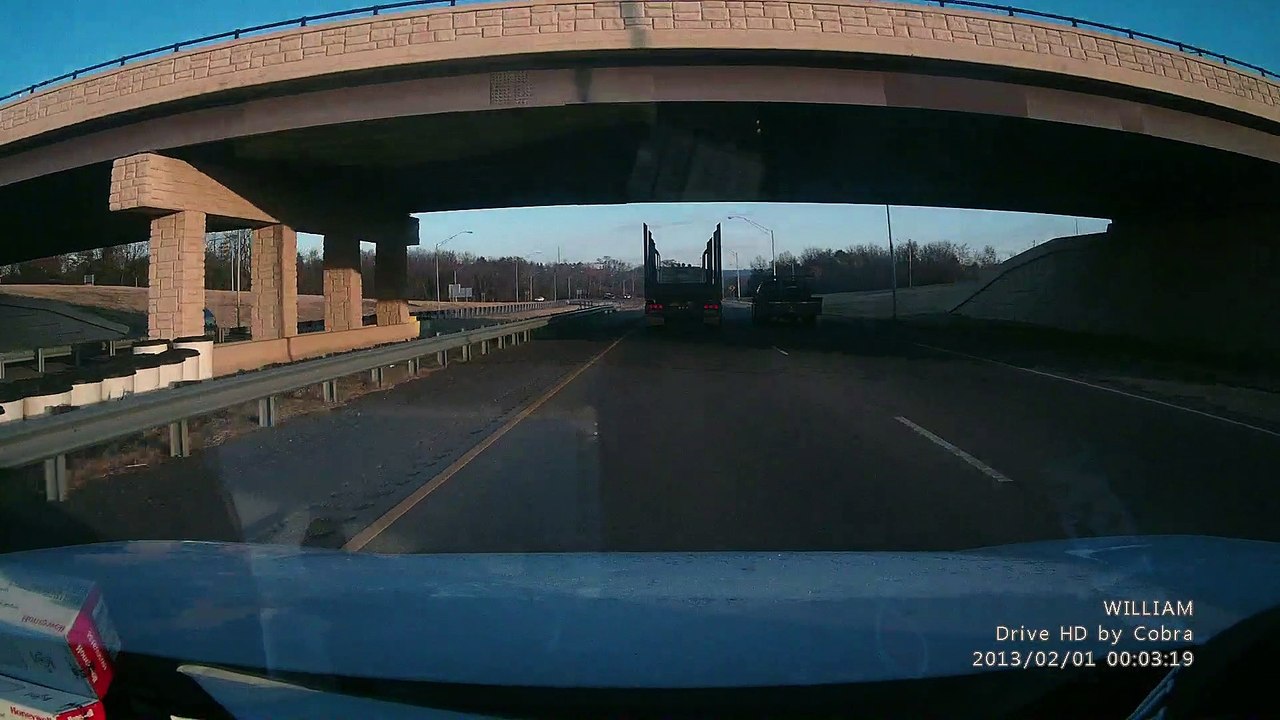 Truck Crosses Highway into Oncoming Cars