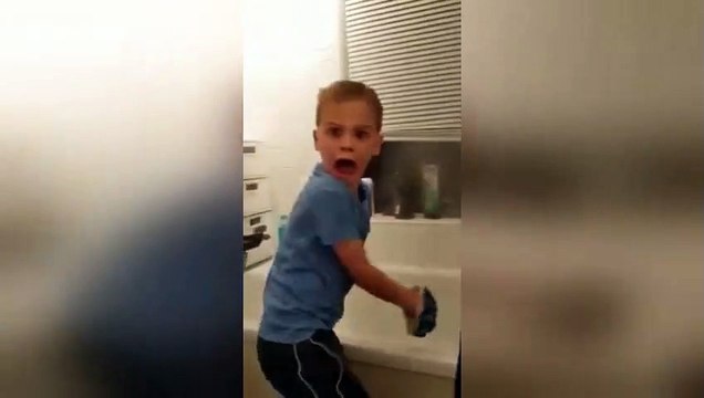 Son's reaction is priceless when dad scares him from behind
