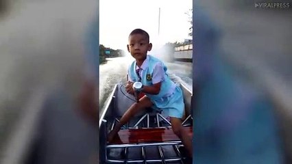 Boy Rides Motor Boat In His School Uniform!
