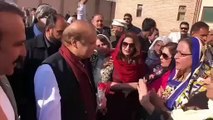 nawaz sharif giving flowers to women workers in accoutibility court