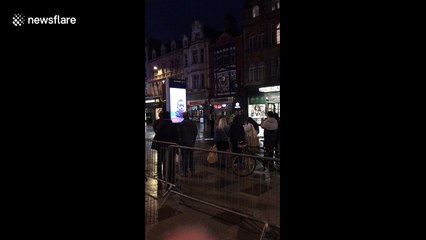 Police escort citizen from St. Mary's Street cordon in Cardiff during 'ongoing incident'