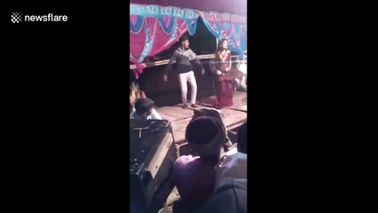 Man fires gun point-blank at Indian wedding dancer, narrowly missing her