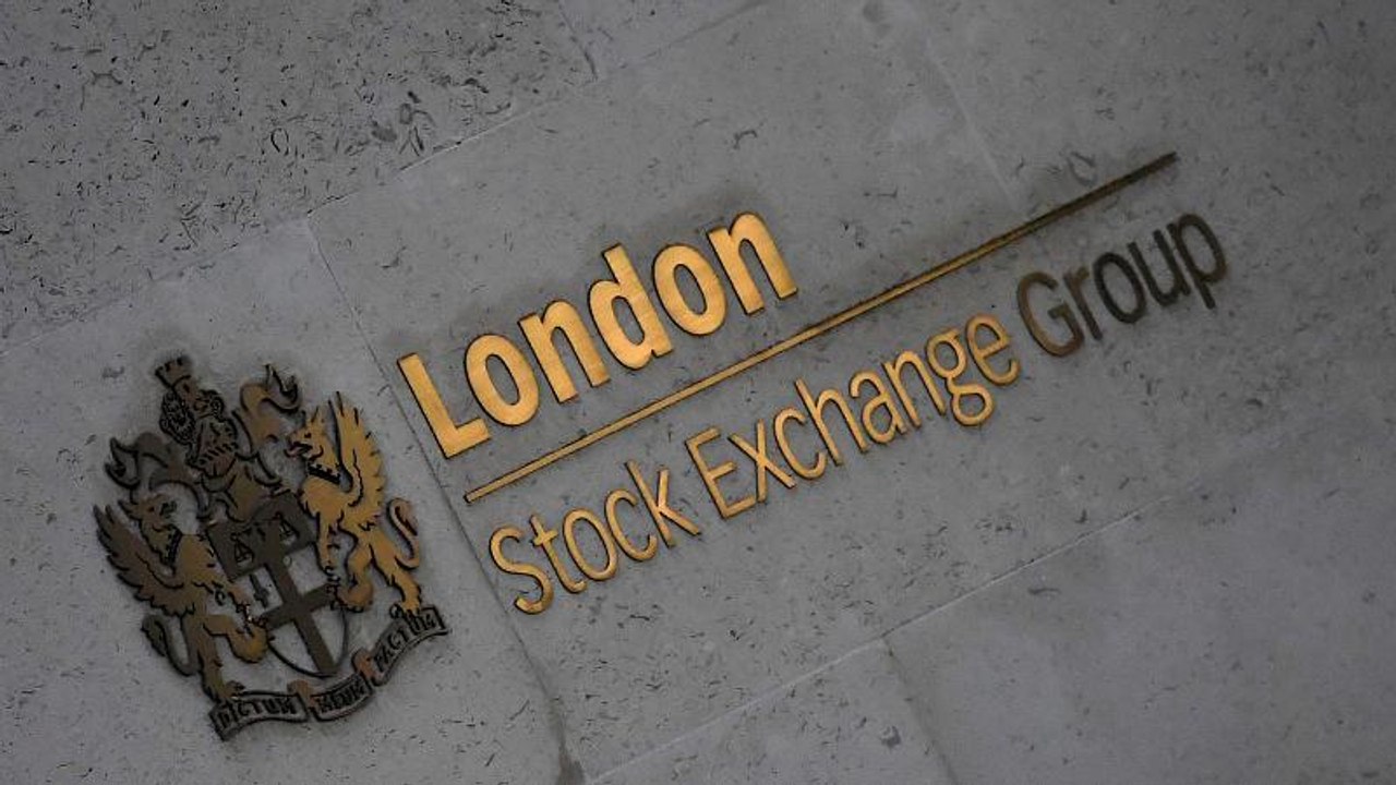 Global growth worries and oil slide drag British stocks down