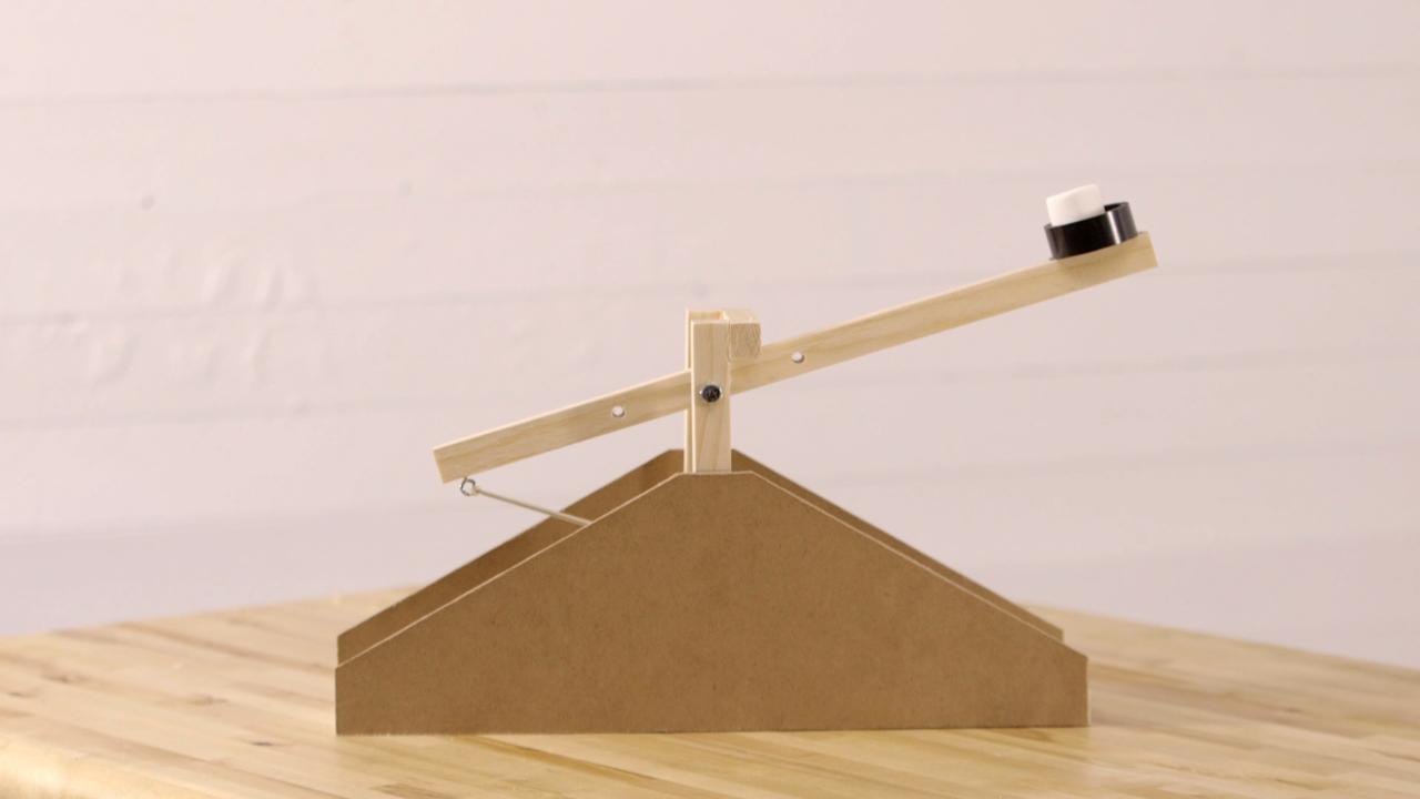 This kid-friendly DIY marshmallow catapult is the perfect summer project