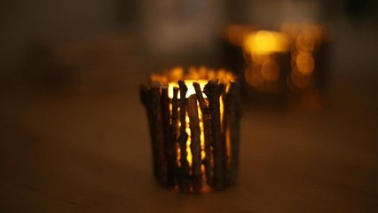 Give your cottage a campfire glow with these twig candle holders