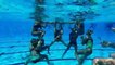 Synchronized Swim Team Does Underwater Pyramid Toss
