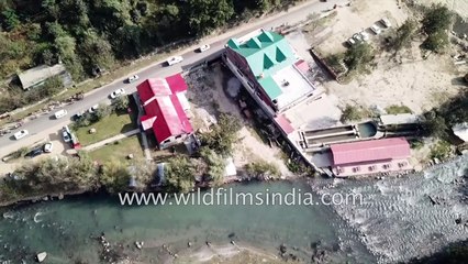 Flying along with raft boats on Beas river in Kullu, Himachal Pradesh