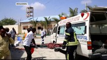 Two car-bomb explosions in the Somali capital kill at least 13