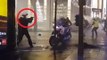 French policeman pulls gun on protesters
