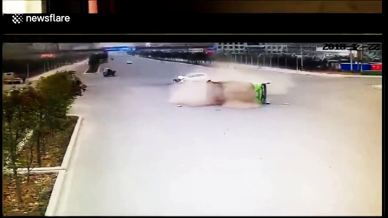 Car hits bus, flipping it over and trapping passengers inside