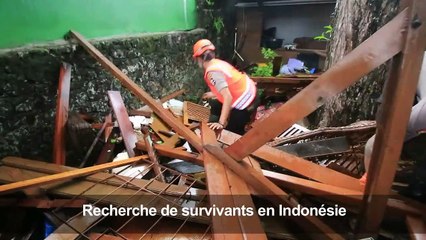Indonésie: les secouristes fouillent les décombres