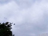 Planes, harvested fields, birds in the sky, clouds