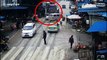 Two pedestrians narrowly escape death after being knocked down by lorry