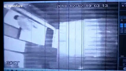 Security camera catches woman throwing rubbish into a lift