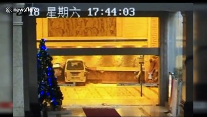 Receptionist narrowly escapes death when minibus careers into hotel lobby