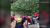 Woman, child saved during dramatic rescue from swollen creek