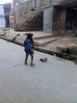 We love this video! Brother and sister playing outside and the girl is hitting a ball with a tiny stick......get her to the Cricket club and playing cricket!