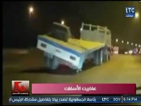 بالقلم الأحمر يعرض فيديو كارثة سيارة نقل كبيرة تسير على الدائري بدون عجلات