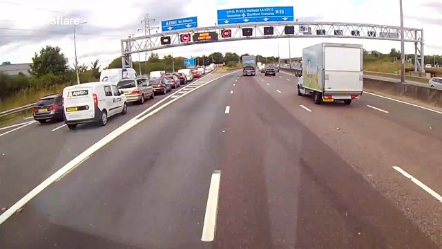 Dash cam footage shows lorry almost causing major accident on busy UK motorway