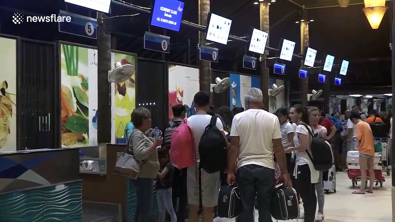 Hundreds of stranded tourists bombard airport as storm approaches Thailand