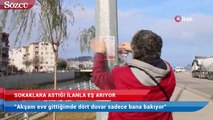 Sokaklara astığı ilanla eş arıyor