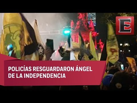 Aficionados celebran el campeonato del América en el Ángel de la Independencia