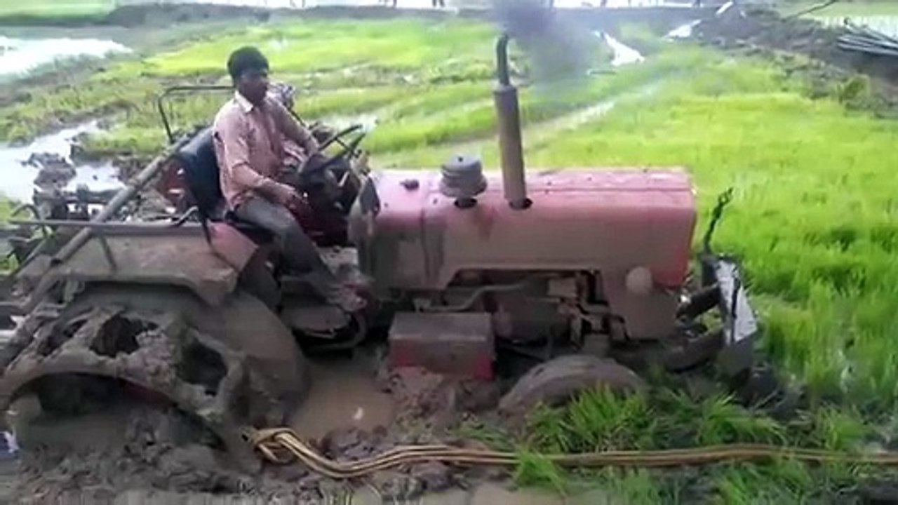Incredible - tractor stuck but somehow gets out...