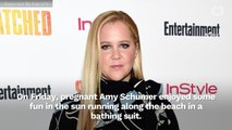 Amy Schumer Shows Off Baby Bump In Swimsuit