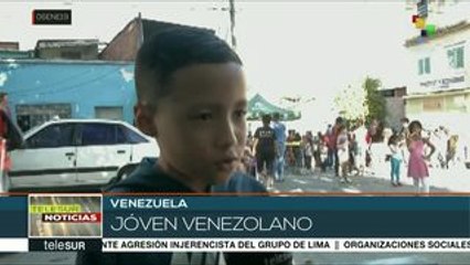 Voluntarios ofrecen diversión y alegría los niños venezolanos el 6-E
