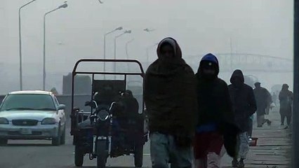 General views of low visibility in Lahore on a winter morning