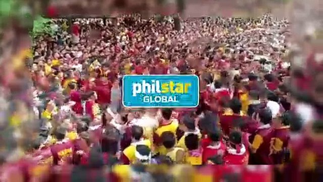 Devotees as they struggle to pull the rope of Black Nazarene