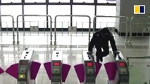 Policeman jumps over ticket gate to save elderly woman on escalator