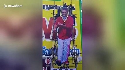 Actor cutout scaffolding collapses as fans climb on top in South India province
